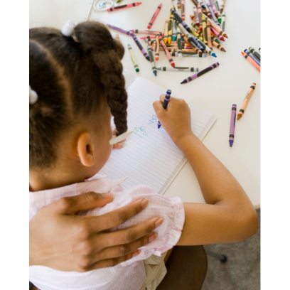 girl coloring with crayons